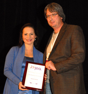 Susan A. Enfield receives the 2012 Administrator of the Year award from Journalism Education Association president Mark Newton.